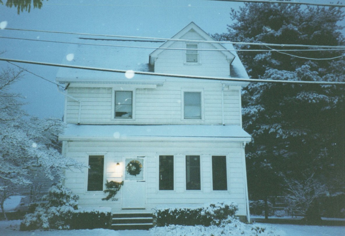  a three story house in the show at night